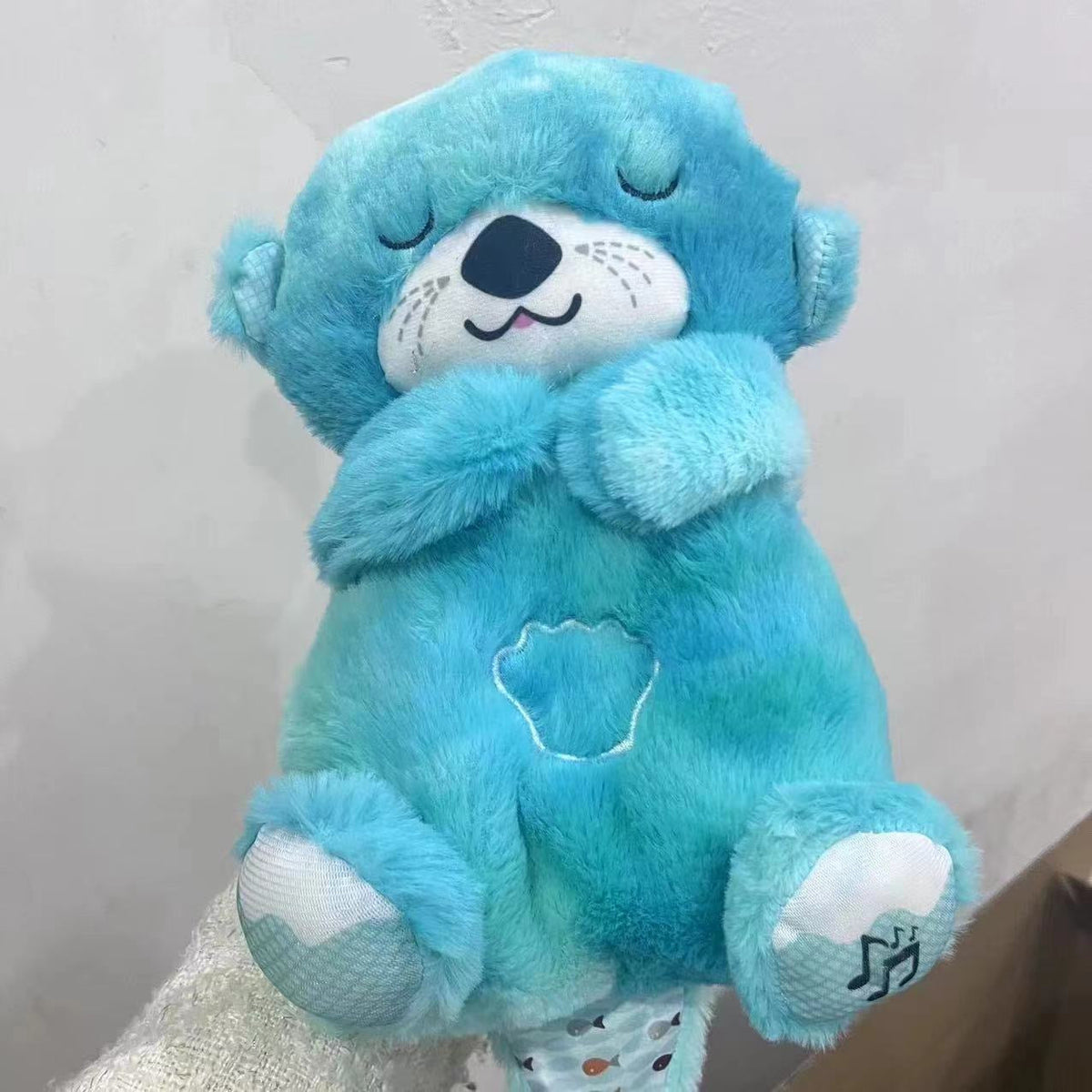 Soundmaschine Soothe 'n Snuggle Otter Tragbares Plüsch-Babyspielzeug mit sensorischen Details, Musik, Lichtern und rhythmischen Atembewegungen